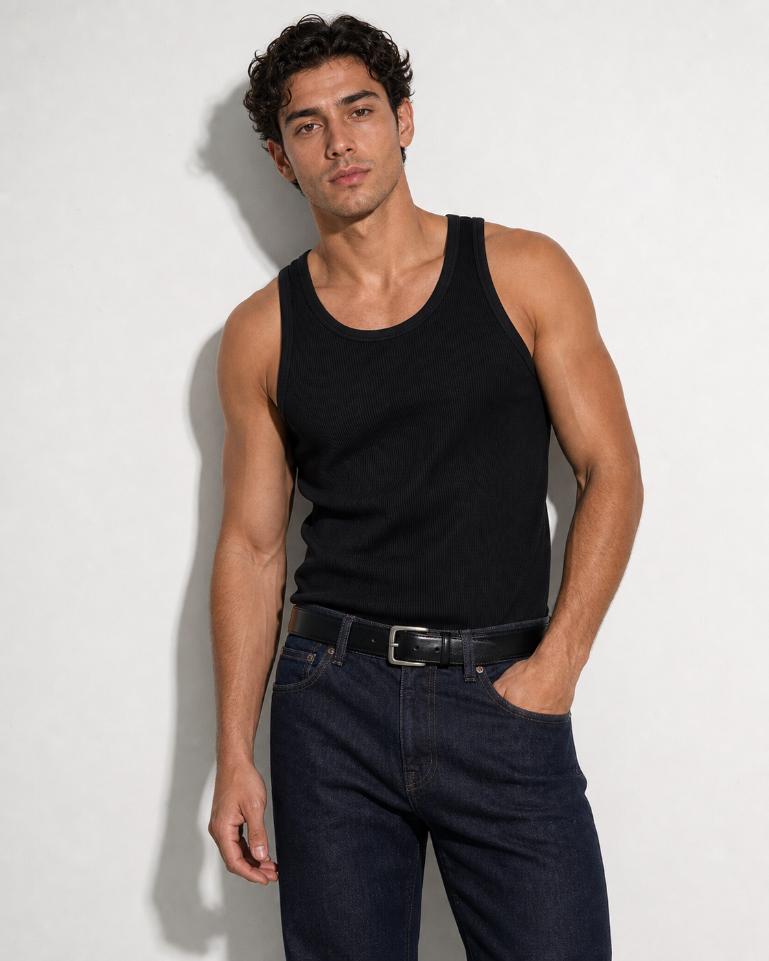 TT001 Essential Tank in black, front view on model – relaxed athletic fit rib tank